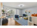 Stylish living room featuring hardwood floors, modern furniture, and ample natural light at 3048 Briarcliff Ne Rd # 2, Atlanta, GA 30329
