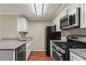 The kitchen has granite countertops, stainless steel appliances, and white cabinets at 1371 Keys Lake Ne Dr, Brookhaven, GA 30319