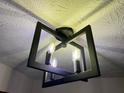 Stylish light fixture with a modern design and unique ceiling texture adds character to the home at 1449 Albans Ct, Lithonia, GA 30058
