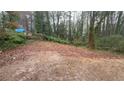 Large lot offering great potential and a view into the tree-filled woods at 1963 Oak Valley Rd, Decatur, GA 30035