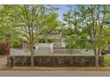 Charming brick home with a white picket fence, green trees and manicured lawn at 1626 Rogers Sw Ave, Atlanta, GA 30310