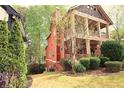 Exterior view of a two-story home featuring a covered porch and landscaped yard at 2313 Bouldercliff Way, Atlanta, GA 30316