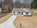 Beautiful single-story home features a well-manicured lawn and inviting facade at 5450 Pine Sw Rd, Mableton, GA 30126