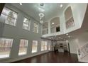 An open floor plan with a grand staircase, high ceilings and lots of windows provides plenty of natural light at 868 Still Hill Ln, Lawrenceville, GA 30045