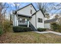 Inviting renovated home with a porch, manicured bushes, and fresh landscaping at 139 Dahlia Nw Ave, Atlanta, GA 30314