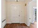 Traditional foyer features hardwood floors, paneled walls, and a stylish light fixture at 2836 Alpine Ne Rd, Atlanta, GA 30305