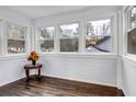 Bright sunroom features shiplap walls, wood floors, many windows, and lovely natural light at 1747 Parkhill Dr, Decatur, GA 30032