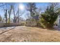 Inviting house with a spacious front yard, classic design elements, and an appealing color scheme at 1824 Westwood Sw Ave, Atlanta, GA 30310