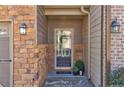 Inviting front entrance with stone accents, decorative lighting, and a welcoming door at 2613 Stonekey Bnd, Lithonia, GA 30058