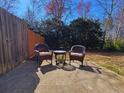 Outdoor patio area with comfortable seating, perfect for relaxing and enjoying the backyard at 2613 Stonekey Bnd, Lithonia, GA 30058