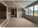 Unfinished living room ready for personalization, featuring large windows and ample natural light at 157 Palisade Dr, Rydal, GA 30171