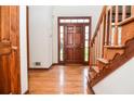 Inviting foyer with hardwood floors and staircase leading to upper level at 1975 Skidmore Cir, Lawrenceville, GA 30044