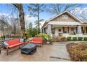 Relaxing outdoor seating area with a firepit in front of a lovely home with welcoming front porch at 2262 Ridgedale Ne Rd, Atlanta, GA 30317