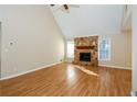 Spacious living room with hardwood floors, stone fireplace and abundant natural light at 241 The Esplanade Se Way, Loganville, GA 30052