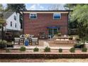 Outdoor patio featuring brick accents, a dining area, and comfortable seating, perfect for outdoor entertainment and relaxation at 412 E Pharr Rd, Decatur, GA 30030