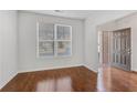 Bright entryway with gleaming hardwood floors, fresh white walls, and a view to the front door at 165 Daisy Cir, Mcdonough, GA 30252