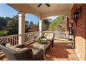 Inviting outdoor porch area with comfortable seating and views of the surrounding landscape at 195 High Bluff Ct, Duluth, GA 30097