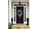 Stylish front door featuring decorative wreath, sidelights and transom window at 1580 Reids Ferry Way, Marietta, GA 30062