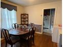 Cozy dining room featuring hardwood floors and classic furnishings adjacent to the kitchen at 804 Maynard Ter, Atlanta, GA 30316