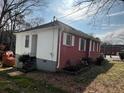 Back view of a house with a brick and white siding exterior and a small deck at 804 Maynard Ter, Atlanta, GA 30316