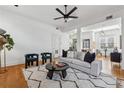 Bright living room featuring hardwood floors, modern furnishings and a decorative fireplace at 1198 Piedmont Ne Ave # 103, Atlanta, GA 30309