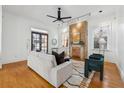 Bright living room featuring hardwood floors, a decorative fireplace and modern furnishings at 1198 Piedmont Ne Ave # 103, Atlanta, GA 30309