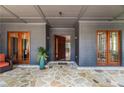 Inviting front entrance featuring stone flooring and a modern wooden door, creating a grand welcome at 3117 W Roxboro Ne Rd, Atlanta, GA 30324