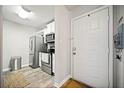 Light and bright entrance way next to the kitchen with stainless steel appliances at 3655 Habersham Ne Rd # B129, Atlanta, GA 30305