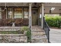 Inviting front porch with stylish seating and a charming entrance to the home at 630 Oakdale Ne Rd, Atlanta, GA 30307