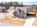 Aerial view of a well-kept home with mature trees, backyard fence and long driveway at 1809 Hanwoo Ln, Powder Springs, GA 30127