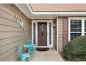 Inviting front entrance with decorative door and accent butterfly art on siding at 2895 Dogwood Creek Pkwy, Duluth, GA 30096