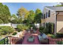 Outdoor patio featuring a brick surface, outdoor furniture, and manicured landscaping at 3786 Turnberry Ct, Duluth, GA 30096