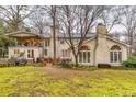 Expansive backyard featuring a patio area, lush greenery, and serene outdoor space at 192 Maple Wood Dr, Lawrenceville, GA 30046