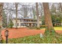 Beautiful home featuring a well-kept lawn, mature trees, and a classic facade at 192 Maple Wood Dr, Lawrenceville, GA 30046