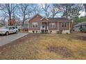 Pleasant home featuring a wood facade, a lovely front porch, and a well-manicured lawn at 2024 Collier W Cir, Decatur, GA 30032