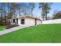 Lovely one-story house boasting a fresh exterior, small porch, and a well-manicured lawn at 3566 Dorris Cir, Douglasville, GA 30135