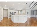 Bright kitchen featuring a center island, stainless steel appliances, and hardwood floors at 11180 West Rd, Roswell, GA 30075