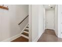 Bright hallway with hardwood floors, staircase, and a clean, modern design at 264 Castleberry Station Sw Dr, Atlanta, GA 30313