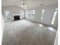 Spacious living area with a fireplace and access to the outdoors at 328 Village Ln, Stockbridge, GA 30281