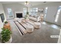 Bright living room features a fireplace, neutral decor, and plush seating, creating a welcoming space at 328 Village Ln, Stockbridge, GA 30281