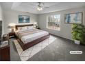 A cozy main bedroom with a plush bed, stylish decor, and bright natural light at 328 Village Ln, Stockbridge, GA 30281