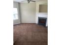 Living room showcasing the fireplace with white mantle and black granite hearth at 8170 Oakley Cir, Union City, GA 30291