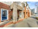 Townhome exterior with brick and stone accents and sidewalk at 201 16Th Nw St # 4, Atlanta, GA 30363