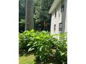 Vibrant flowers and lush greenery adorn the side of this well-maintained home at 184 Wana Se Cir, Mableton, GA 30126