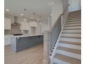 Modern kitchen features a large island with a sink and stainless steel appliances at 3316 Cranston Ln, Kennesaw, GA 30144