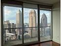 Stunning city skyline views from the floor-to-ceiling windows and balcony offer a picturesque living experience at 1080 Peachtree Ne St # 2915, Atlanta, GA 30309