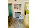 Elegant fireplace featuring black and white tile and a cozy chair at 3251 Abbeywood Dr, Decatur, GA 30034