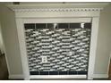 Close up on the black and white tiled fireplace at 3251 Abbeywood Dr, Decatur, GA 30034