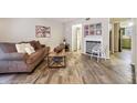 Living room with wood floors, fireplace and comfortable sofa at 3251 Abbeywood Dr, Decatur, GA 30034