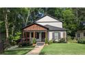 Beautiful home with a charming front porch and well-maintained lawn at 657 S Grand Nw Ave, Atlanta, GA 30318